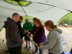 Scout Leaders Practicing Pioneering and Knotting